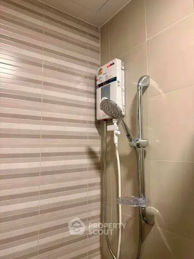 Modern bathroom with sleek shower unit and stylish tile design