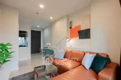 Modern living room with stylish leather sofa and contemporary decor