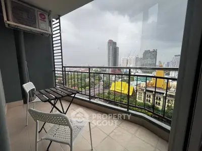 Spacious balcony with city skyline view, perfect for relaxing and enjoying urban scenery.
