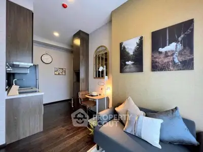Modern living room with cozy sofa and stylish decor in a contemporary apartment.