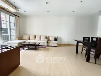 Spacious living room with modern furniture and natural light