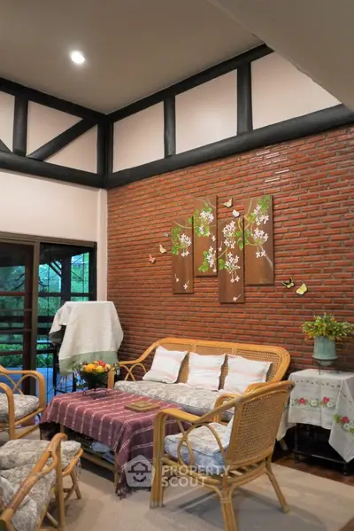 Charming living room with rustic brick wall and cozy rattan furniture