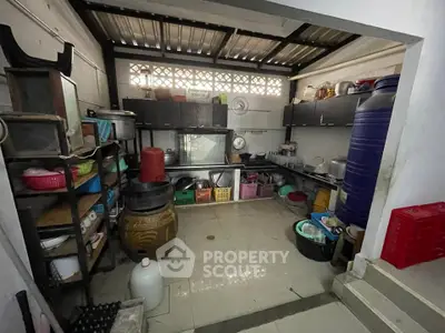 Cozy kitchen with ample storage and rustic charm, perfect for culinary enthusiasts.