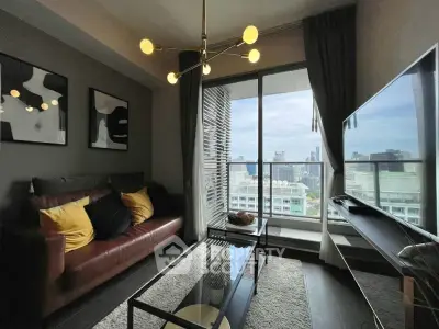 Modern living room with city view, stylish decor, and large windows for natural light.