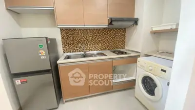 Modern kitchen with mosaic backsplash, fridge, and washing machine