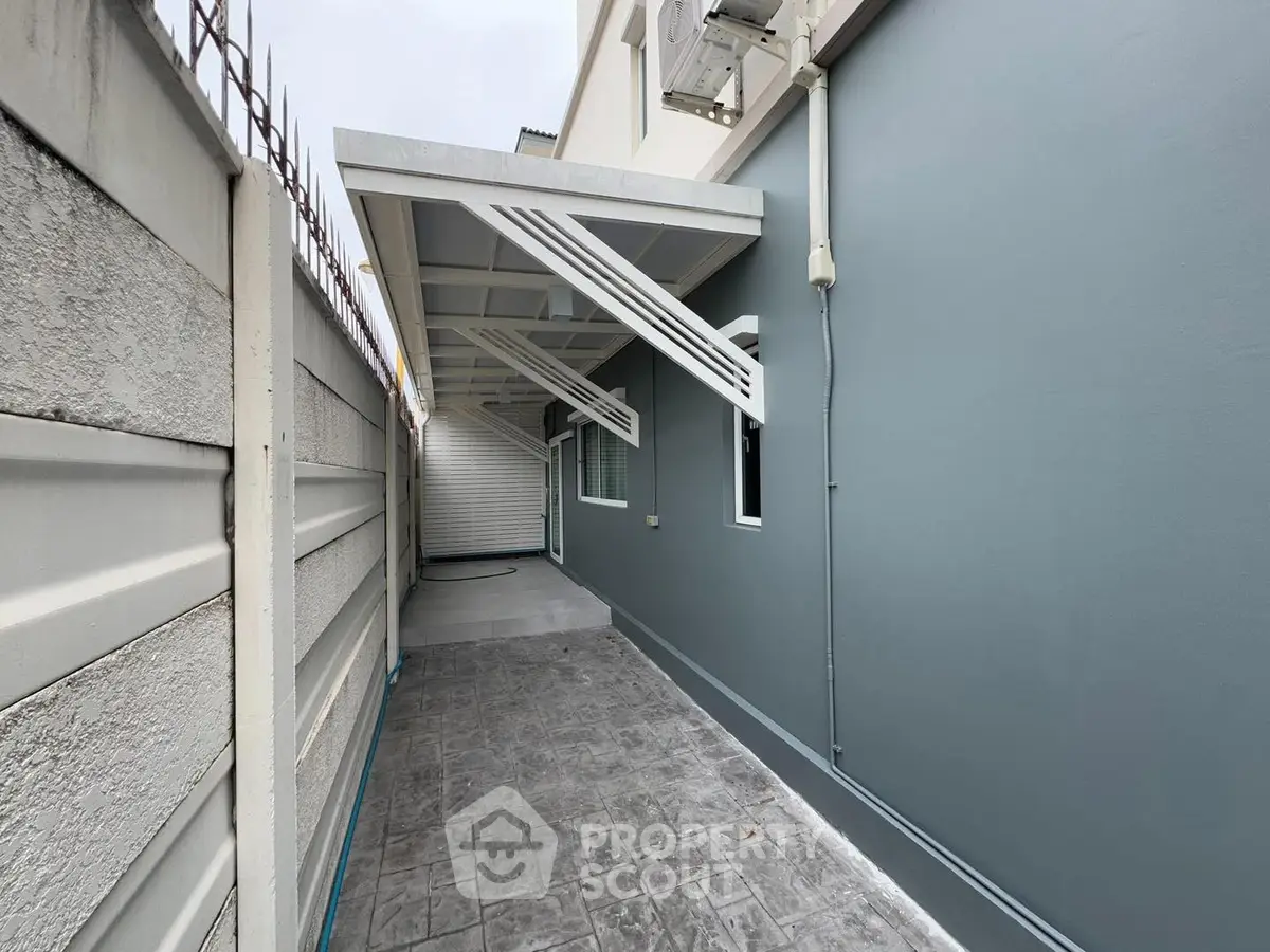 Modern exterior with sleek design and covered walkway, ideal for privacy and security.