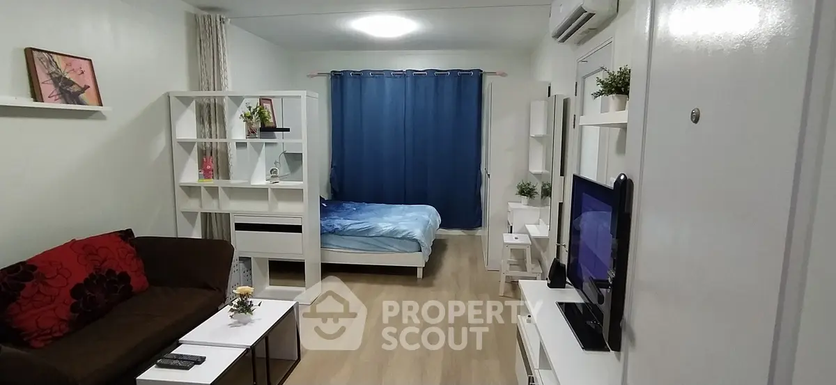 Modern studio apartment with cozy living area and stylish decor