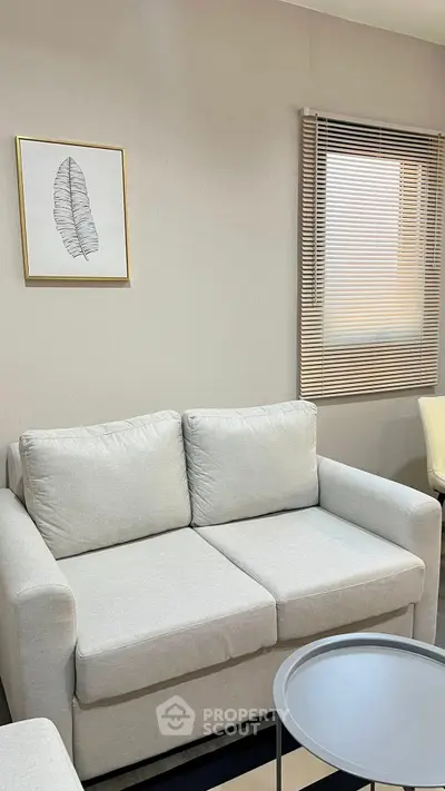 Cozy living room with modern gray sofa and stylish decor