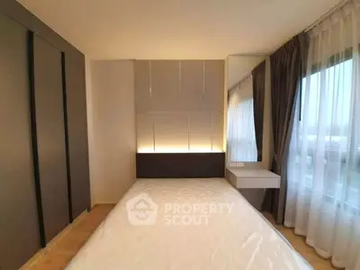 Modern bedroom with large windows and sleek design