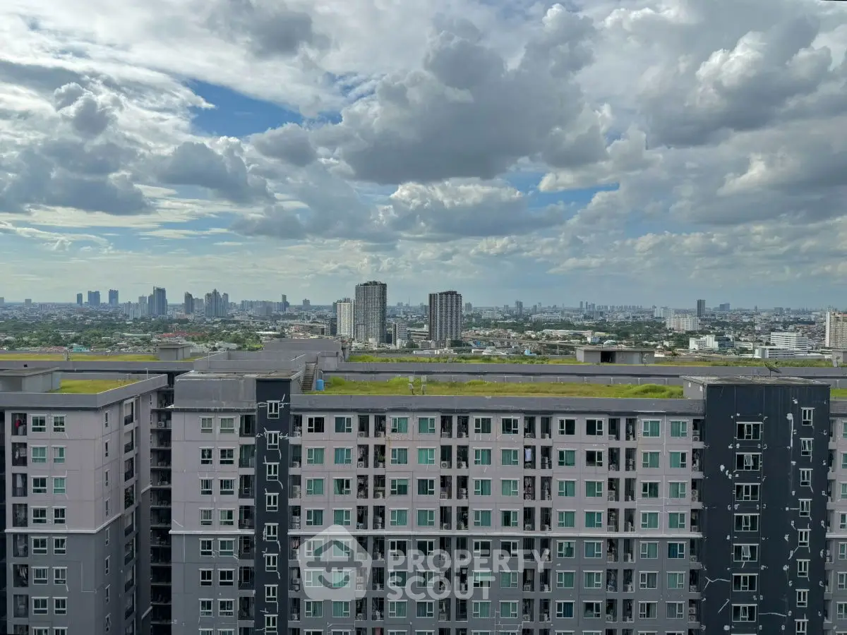 Stunning cityscape view from high-rise apartment with expansive skyline and modern architecture.