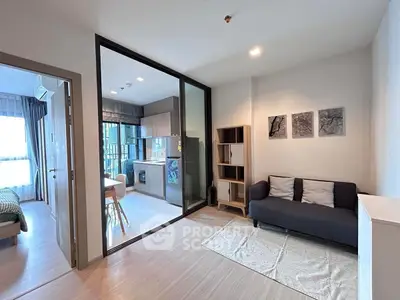 Modern living room with open layout and stylish decor in a contemporary apartment.