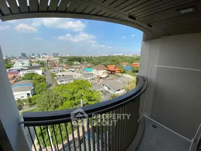 Stunning balcony view overlooking a vibrant cityscape with lush greenery and urban skyline.