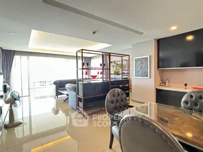 Spacious modern living room with elegant decor and open layout, featuring luxurious furniture and ample natural light.