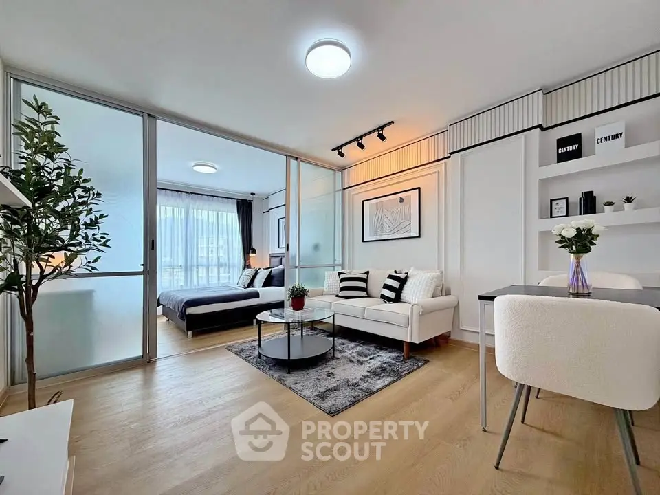 Modern open-plan living room with stylish decor and natural light