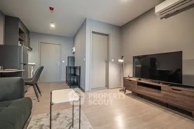 Modern living room with sleek furniture and open kitchen layout