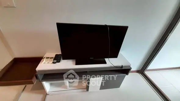 Modern living room with sleek TV setup and stylish furniture