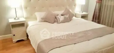 Elegant bedroom with plush headboard and cozy lighting