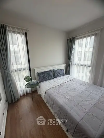 Cozy bedroom with natural light and modern decor in a stylish apartment
