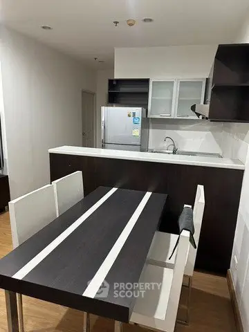 Modern kitchen with sleek dining area and contemporary design