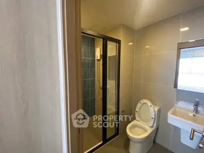 Modern bathroom with glass shower and sleek fixtures