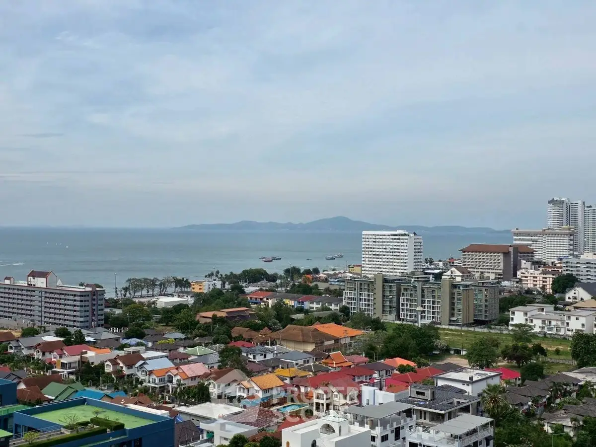 Stunning coastal cityscape with ocean view and modern buildings.