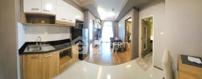 Spacious open-plan kitchen and living area with modern design and natural light.