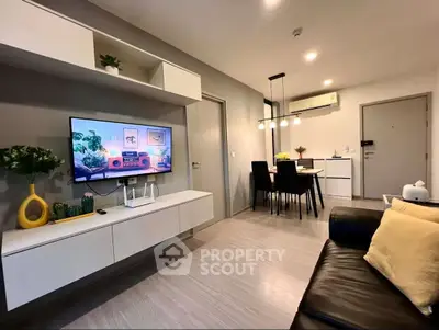 Modern living room with sleek furniture and dining area, perfect for urban living.