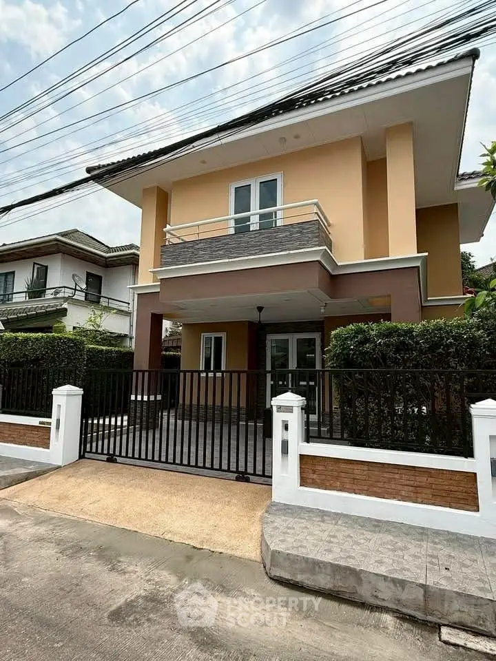 Charming two-story house with modern design and spacious balcony in a serene neighborhood.