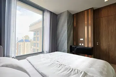 Luxurious bedroom with city view and modern design