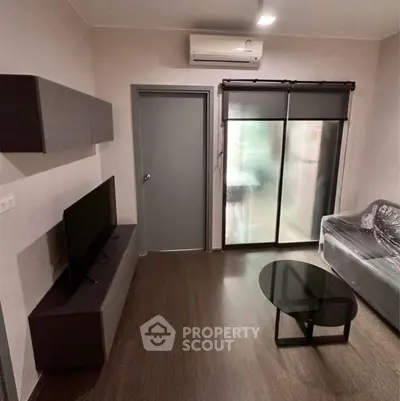 Modern living room with sleek furniture and air conditioning