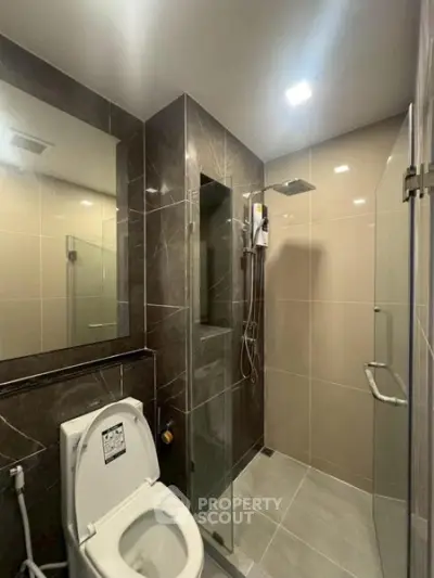 Modern bathroom with sleek design and glass shower enclosure