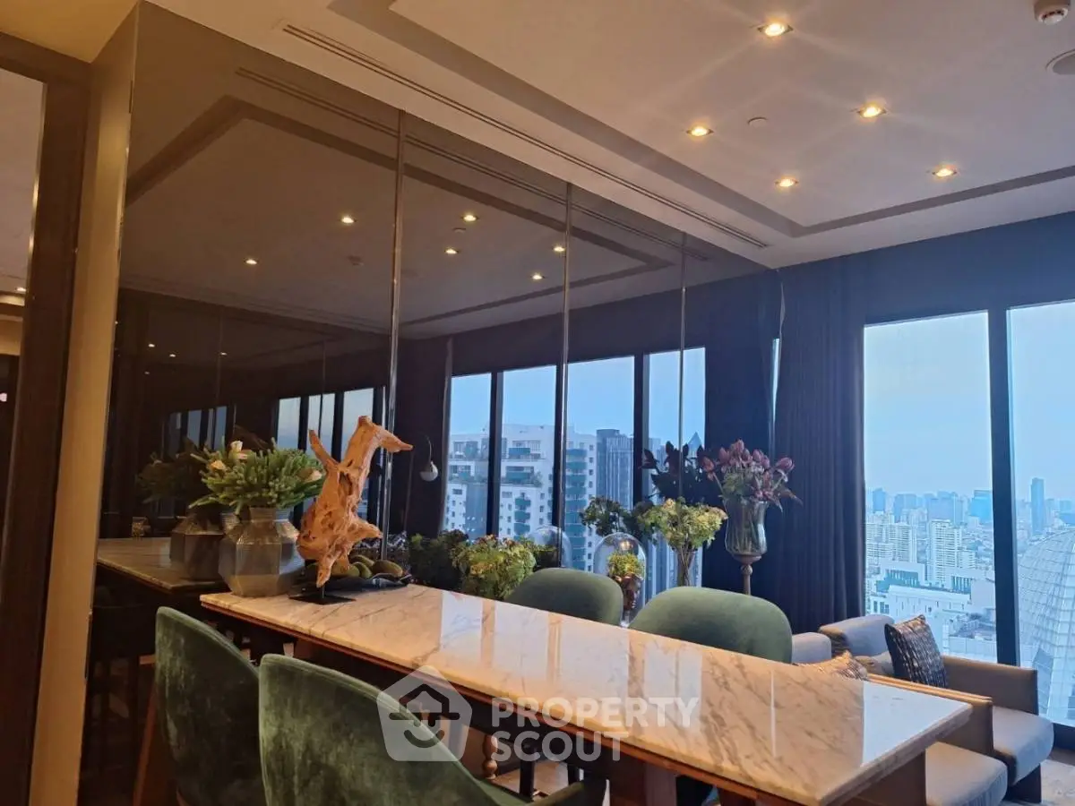 Luxurious dining area with city view, featuring elegant marble table and plush seating in modern apartment.