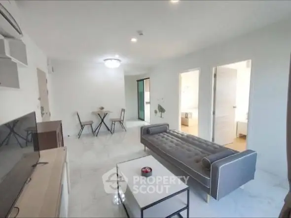 Spacious modern living room with sleek furniture and marble flooring