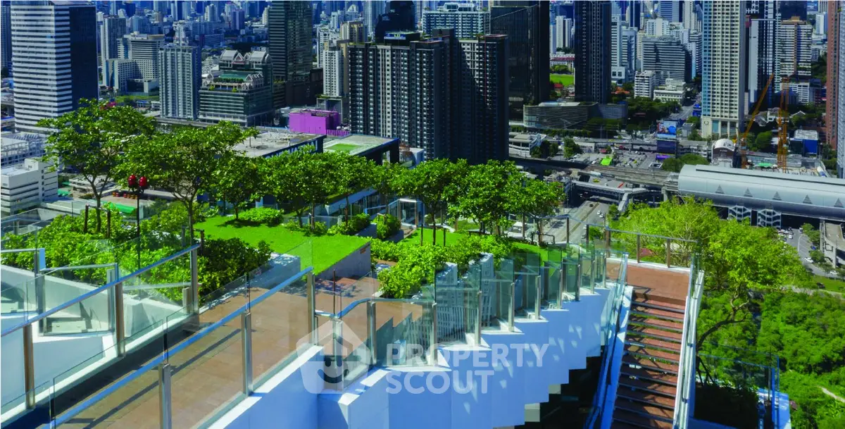 Stunning rooftop garden with panoramic city views and modern glass railings.