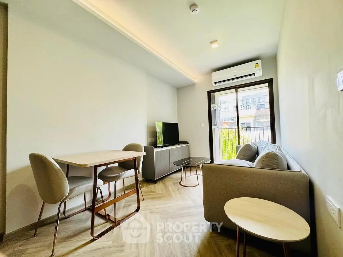 Modern living room with stylish furniture and natural light, perfect for urban living.