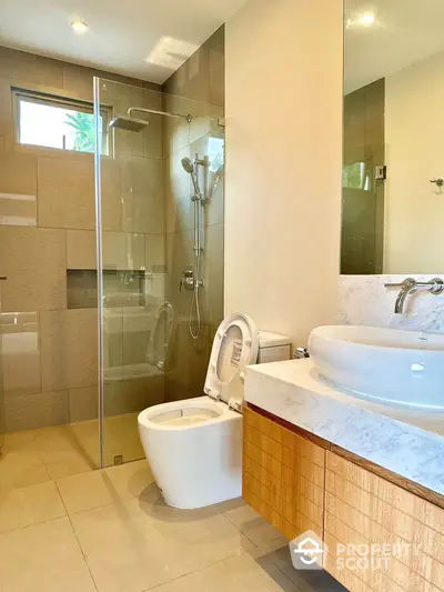 Modern bathroom with glass shower and elegant vanity