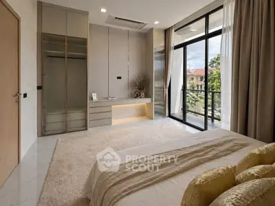 Luxurious bedroom with floor-to-ceiling windows and elegant decor