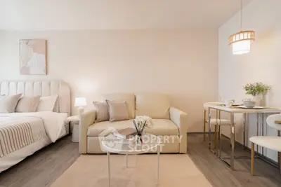 Modern studio apartment with cozy living area and elegant decor