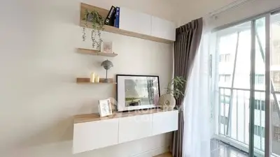 Stylish modern living room with elegant shelving and balcony view