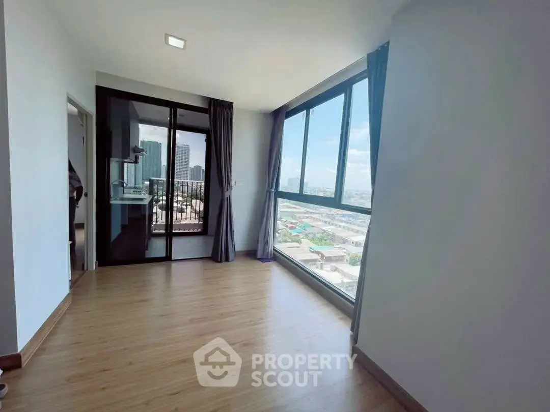 Spacious corner unit with floor-to-ceiling windows offering a stunning city view and natural light.