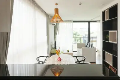 Modern living room with large windows and stylish decor