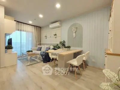 Charming open-plan living and dining area with modern decor and natural light.