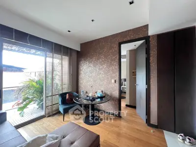 Stylish living room with balcony access and modern decor