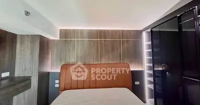 Modern bedroom with stylish lighting and sleek design elements