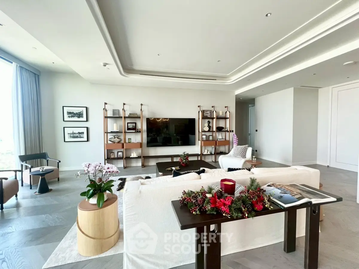 Luxurious living room with elegant decor and large windows offering natural light