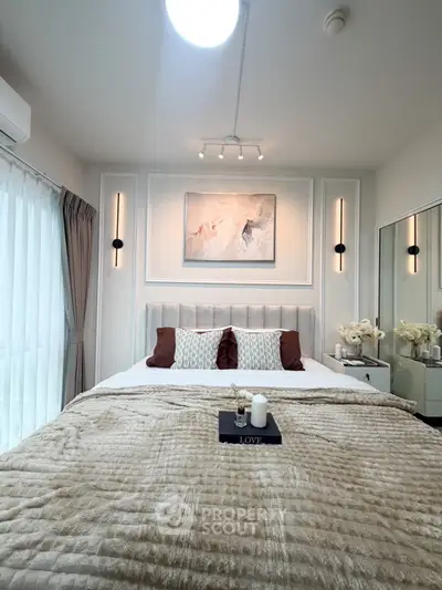 Luxurious bedroom with elegant decor and plush bedding in modern apartment