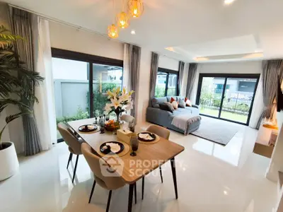 Spacious modern living room with elegant dining area and garden view.