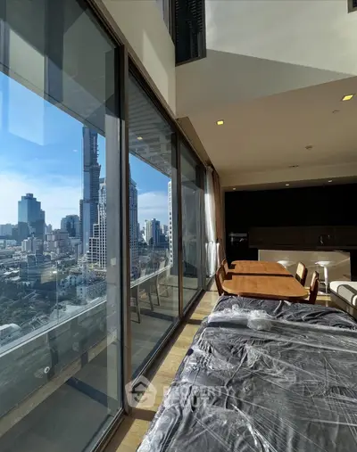 Luxurious high-rise apartment with stunning city view and modern interior design.
