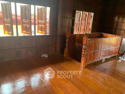 Charming wooden interior with polished floors and traditional design, perfect for a cozy and rustic living space.