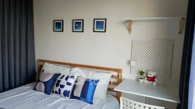 Cozy bedroom with stylish decor and natural light